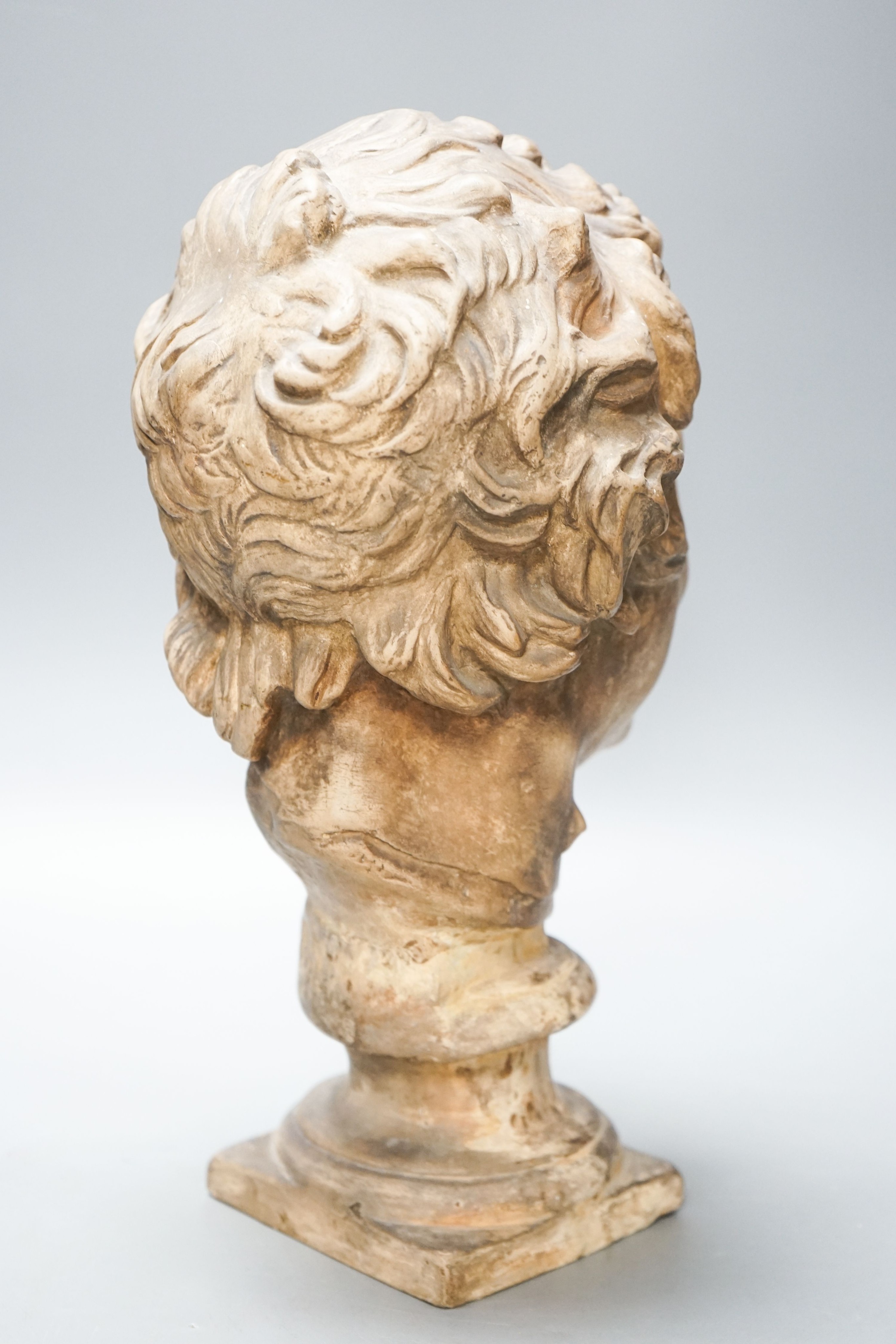 An earthenware bust of a faun, 32cm